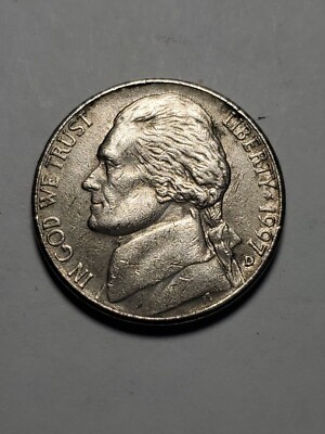 1997 Jefferson nickel doubled die error showing visible doubling on lettering and date numerals under magnification